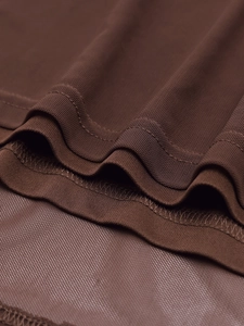 Detailed macro view of chocolate brown mesh fabric with high-quality double-needle stitching
