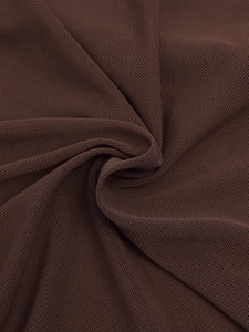 Detail of coffee brown fine mesh fabric with breathable texture and soft drape