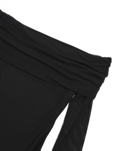 Detailed view of black mesh fabric showing the draped neckline and fine texture