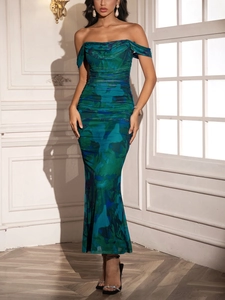 Detail of off-the-shoulder maxi dress with teal marble print and ruched fabric texture