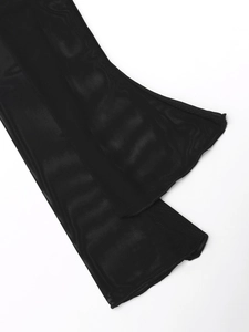 Close-up of sheer black mesh fabric detailing with fine stitching and bell sleeve finish