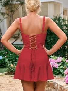 Detail view of the sexy backless red dress featuring adjustable lace-up crisscross straps