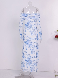 Detail of off-shoulder floral maxi dress with blue flower pattern and long mesh sleeves