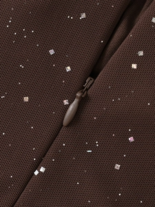 Macro di tessuto a rete marrone con paillettes argentate e cerniera a scomparsa