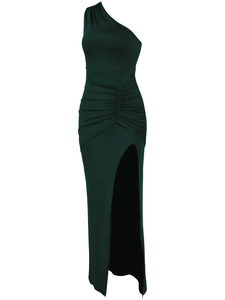 Detail of emerald green one-shoulder dress featuring waist pleats and high slit design