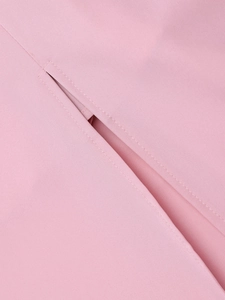 Close-up of fine stitching and welt pocket detail on light pink fishtail dress