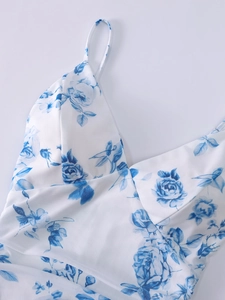 Detail of V-neck mesh dress featuring blue rose print and delicate thin straps