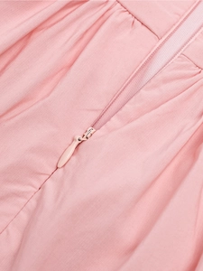 Close-up of high-quality concealed teardrop zipper on pink lace cocktail dress