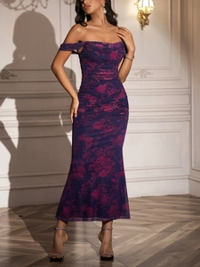 Close-up of off-shoulder neckline and purple floral pattern on a mesh bodycon dress