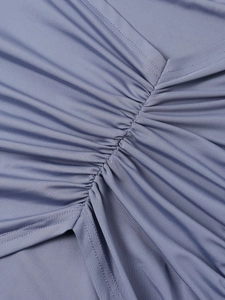 Detail of ruched milk silk fabric showing fine stitching and smooth knitted texture