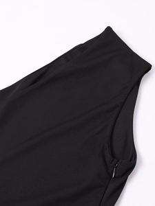 Detail of invisible zipper closure and knit fabric texture on a black fitted dress