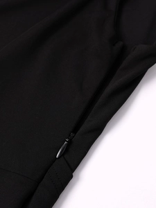 Close-up of black milk silk dress featuring a hidden zipper and high-quality fabric texture
