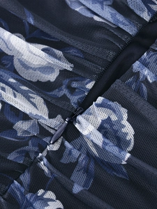Detail of the invisible zipper on blue floral mesh dress with gathered pleated fabric