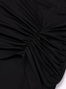 Macro view of ruched detail and stitched pleats on the black milk silk evening dress