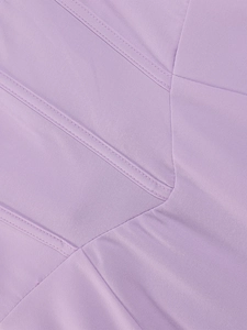 Close-up of the lilac corset dress detailing fine double-needle stitching and fabric