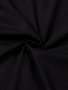 Close-up detail of soft black milk silk fabric texture with elegant pleated drape