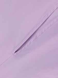 Detail of lavender purple fabric showing smooth texture and high-quality diagonal stitching