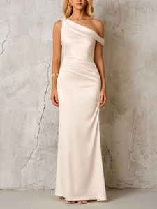 Detailed close-up of champagne satin one-shoulder dress featuring elegant draped pleats