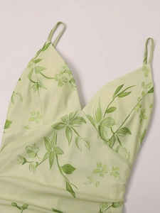 Detail of the V-neck mesh dress with green leaf floral prints and thin straps