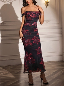 Detail of off-shoulder mesh evening dress with elegant red lily print and ruched neckline