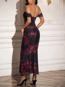 Detail view of the backless design and ruched detail on a floral off-shoulder maxi dress