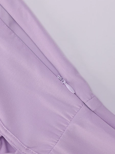 Detail of invisible zipper and twill fabric texture on lilac corset fishbone maxi dress