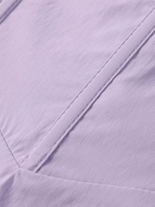 Detailed macro view of light purple fabric with vertical stripes and double stitched seams