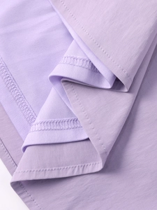 Macro detail of purple fishbone dress showing fine texture and breathable mesh lining