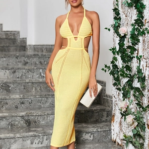 Pale yellow knitted halter maxi dress with waist cutouts and deep V-neckline for summer