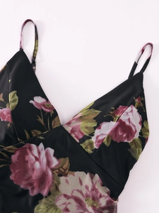 Detail view of mesh dress neckline featuring pink rose prints and slim V-neck straps