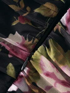 Detailed macro view of invisible zipper on vintage floral print mesh dress fabric