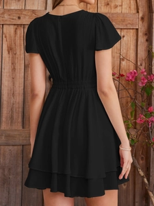 Elegant black mini dress with layered ruffle hem and back hidden zipper detail