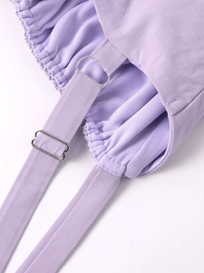 Close-up of lavender ribbed dress featuring adjustable straps and silver metal rings