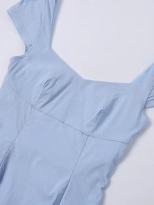 Detail of light blue dress showing elegant sweetheart neckline and woven fabric texture