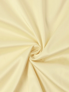 Detailed macro view of cream satin fabric showing smooth texture and elegant drape
