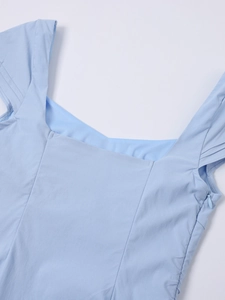 Detail of square neckline with pleated wide straps and invisible side zipper on blue dress