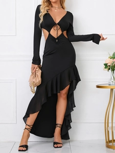 Detail view of black cut-out dress with ruffled hem and sexy lace-up chest design