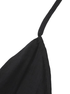 Detail shot of black halter straps with precise stitching on high-quality fabric