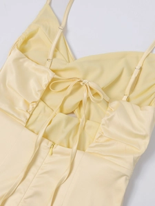 Detail of satin dress featuring adjustable straps and lace-up back with invisible zipper