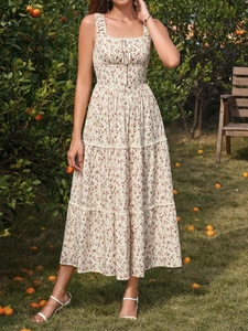 Detailed view of the square neck and tiered ruffle layers of a floral summer dress