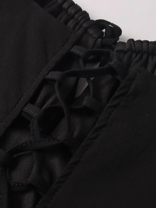Detailed view of the black lace-up corset front with delicate ruching and fabric ties