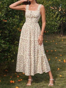 Detail of floral tiered dress with square neckline and delicate lace trim details
