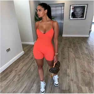 Women's orange ribbed sleeveless romper with slim fit and spaghetti straps for casual wear