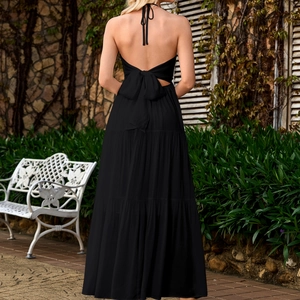 Elegant black halter neck backless tiered maxi dress with large waist bow detail