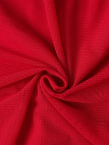 Close-up detail of breathable red fishbone mesh fabric with elegant draped pleats