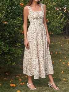 Detail of floral print maxi dress with square neckline and tiered lace trimming