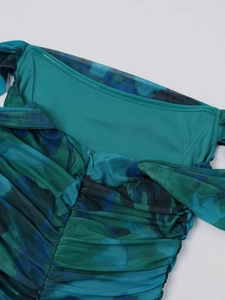Detail of blue fishbone mesh dress showing back invisible zipper and double-layer fabric