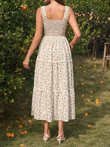 Detail of smocked back design and lace trim on a floral French style summer dress