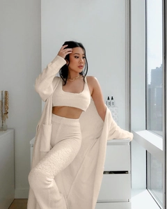 Detailed texture of beige plush knit loungewear set featuring long cardigan and trousers