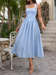 Detail view of light blue halter midi dress with flattering waist cut-out and flared skirt